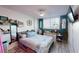 Cozy bedroom with wood-look flooring and decorative accents at 2727 N Atlantic Ave # 203, Daytona Beach, FL 32118