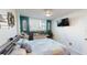 Alternative angle of the bedroom highlighting the window and plants at 2727 N Atlantic Ave # 203, Daytona Beach, FL 32118