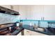 Kitchen featuring black appliances, dark countertops, and light-colored cabinets at 2727 N Atlantic Ave # 203, Daytona Beach, FL 32118