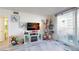 Welcoming living area with electric fireplace and holiday decorations at 2727 N Atlantic Ave # 203, Daytona Beach, FL 32118