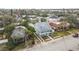 Aerial view of a neighborhood with houses, trees, and a street at 318 Vermont Ave, Daytona Beach, FL 32118