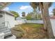 Fenced backyard with a detached shed and lush green grass at 318 Vermont Ave, Daytona Beach, FL 32118