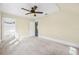 Spacious bedroom with carpet, ceiling fan, and walk-in closet at 318 Vermont Ave, Daytona Beach, FL 32118