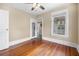 Bedroom with wood floors, ceiling fan, and views from two windows at 318 Vermont Ave, Daytona Beach, FL 32118