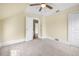Bedroom with carpet, ceiling fan, and doorways to adjacent rooms at 318 Vermont Ave, Daytona Beach, FL 32118