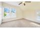 Bedroom with carpet, large windows, and a ceiling fan at 318 Vermont Ave, Daytona Beach, FL 32118