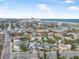 Expansive aerial view encompassing the neighborhood and the coastline in the distance at 318 Vermont Ave, Daytona Beach, FL 32118