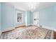 Dining room with chandelier, large area rug, and hardwood floors at 318 Vermont Ave, Daytona Beach, FL 32118