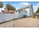 Exterior view of a light blue home with a detached garage and driveway at 318 Vermont Ave, Daytona Beach, FL 32118