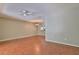 Living room with wood-look floors, a ceiling fan, and a chandelier at 3522 Forest Branch Dr # D, Port Orange, FL 32129