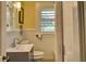 Bright bathroom with white tile, a single vanity, and a shower at 546 Rio Vista Ave, Daytona Beach, FL 32114