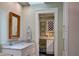 Bathroom with vanity and a doorway leading to a wine refrigerator and storage at 546 Rio Vista Ave, Daytona Beach, FL 32114