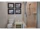 Modern bathroom featuring a walk-in shower, toilet, and framed artwork at 546 Rio Vista Ave, Daytona Beach, FL 32114