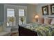 Inviting bedroom with a comfortable bed, an armchair, and waterfront views at 546 Rio Vista Ave, Daytona Beach, FL 32114