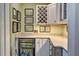 Butler's pantry featuring white cabinetry, a wine rack, and a beverage cooler at 546 Rio Vista Ave, Daytona Beach, FL 32114