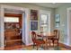 Cozy dining area with a small round table, adjacent to a sitting area with built-in shelves at 546 Rio Vista Ave, Daytona Beach, FL 32114