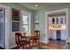 Dining area with a round wooden table, and a view of the butler's pantry at 546 Rio Vista Ave, Daytona Beach, FL 32114