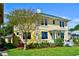 Charming yellow home with lush landscaping and mature trees at 546 Rio Vista Ave, Daytona Beach, FL 32114