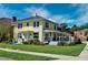 Yellow home with a back patio and mature landscaping at 546 Rio Vista Ave, Daytona Beach, FL 32114