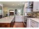 Modern kitchen with white cabinets, stainless steel appliances, and a large island at 546 Rio Vista Ave, Daytona Beach, FL 32114