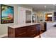 Kitchen island with dark wood cabinets, quartz countertops, and stainless steel appliances at 546 Rio Vista Ave, Daytona Beach, FL 32114