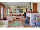Cozy living room with fireplace, comfortable seating, and colorful decor at 546 Rio Vista Ave, Daytona Beach, FL 32114