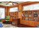 Charming home office with wood paneling, built-in shelving, and abundant natural light at 546 Rio Vista Ave, Daytona Beach, FL 32114