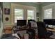 Home office with two workstations, a printer, and ample natural light at 546 Rio Vista Ave, Daytona Beach, FL 32114