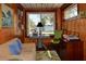 Home office with wood paneling, a desk, and views of the water at 546 Rio Vista Ave, Daytona Beach, FL 32114