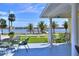 Enjoy waterfront views from this charming deck with seating, perfect for relaxation at 546 Rio Vista Ave, Daytona Beach, FL 32114