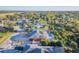 Aerial view of a house with a pool and solar panels, located in a residential neighborhood at 5923 Shady Creek Ln, Port Orange, FL 32128