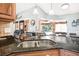 Double stainless steel sink with granite countertop at 5923 Shady Creek Ln, Port Orange, FL 32128