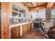 Outdoor kitchen with sink, range and wooden cabinets at 5923 Shady Creek Ln, Port Orange, FL 32128