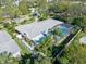 Aerial view showcasing home, pool, and fenced backyard at 106 Sundance Trl, Ormond Beach, FL 32176