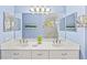 Double vanity bathroom with a large mirror and tiled floor at 1333 Asher Ct # 1333, Ormond Beach, FL 32174
