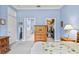 Bright bedroom with a queen bed, walk-in closet, and bathroom access at 1333 Asher Ct # 1333, Ormond Beach, FL 32174