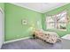 Bedroom with window, and a light green wall at 1333 Asher Ct # 1333, Ormond Beach, FL 32174