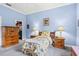 Light and airy bedroom with wood furniture and adjacent closet at 1333 Asher Ct # 1333, Ormond Beach, FL 32174