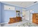 Bedroom with a queen bed, dresser, and access to the bathroom at 1333 Asher Ct # 1333, Ormond Beach, FL 32174