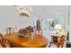 Bright dining room with hardwood table and access to the kitchen and living room at 1333 Asher Ct # 1333, Ormond Beach, FL 32174