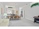Dining room with a lovely chandelier and views into the kitchen and living room at 1333 Asher Ct # 1333, Ormond Beach, FL 32174