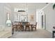 Open concept dining room with a chandelier and views to the kitchen and living areas at 1333 Asher Ct # 1333, Ormond Beach, FL 32174