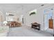 Bright dining room featuring a table with chairs and access to other rooms at 1333 Asher Ct # 1333, Ormond Beach, FL 32174