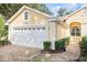 House exterior featuring a two-car garage and well-manicured landscaping at 1333 Asher Ct # 1333, Ormond Beach, FL 32174