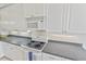 Clean and bright kitchen with white cabinets and granite countertops at 1333 Asher Ct # 1333, Ormond Beach, FL 32174