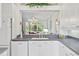 Modern kitchen with white cabinets, granite countertops and a breakfast bar at 1333 Asher Ct # 1333, Ormond Beach, FL 32174