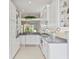 Bright eat-in kitchen with white cabinets, granite countertops, and stainless steel appliances at 1333 Asher Ct # 1333, Ormond Beach, FL 32174