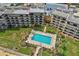 Aerial perspective showcasing building, pool, and parking at 2700 Ocean Shore Blvd # 5080, Ormond Beach, FL 32176