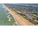 Wide view of oceanfront building and beach at 2700 Ocean Shore Blvd # 508, Ormond Beach, FL 32176