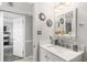 Bathroom with a white vanity and a view into another room at 2700 Ocean Shore Blvd # 508, Ormond Beach, FL 32176